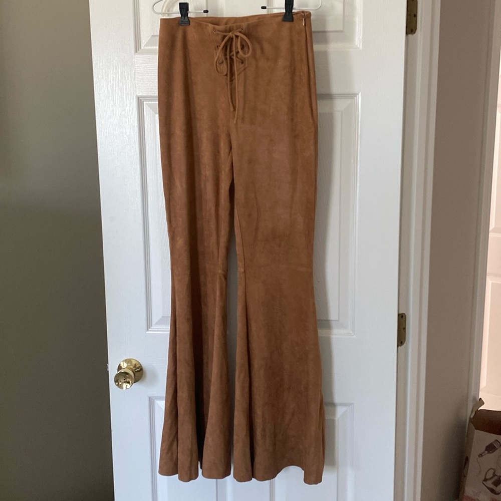 Vici faux suede bell bottom tie up pants with side zipper.